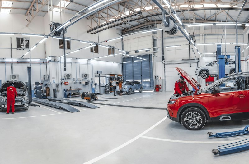 Bright auto repair shop with a clean coated floor